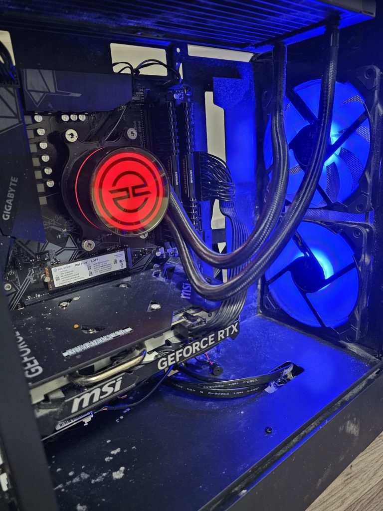 Gaming PC opened up for fault diagnosis on the Ilford workbench