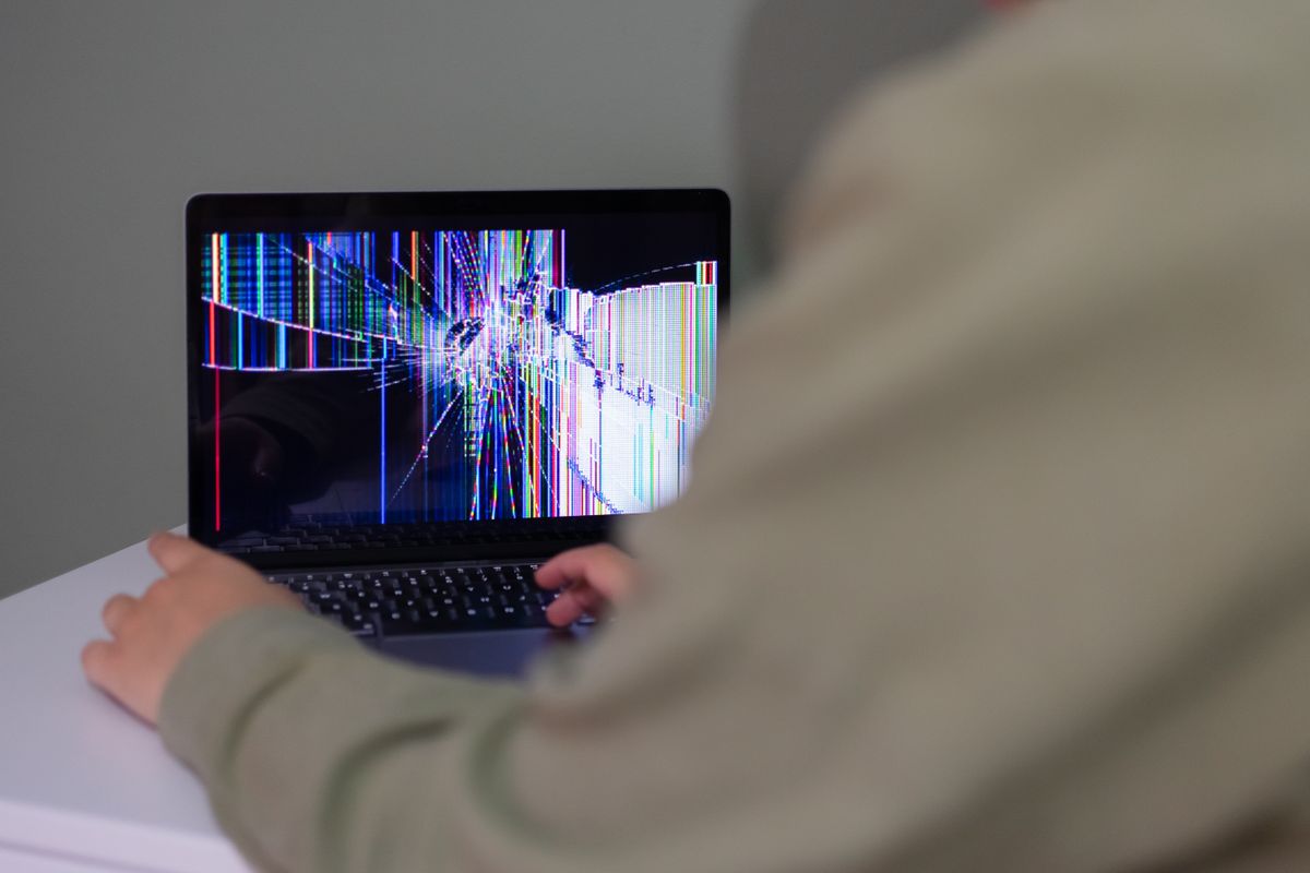 Laptop with a cracked, distorted screen